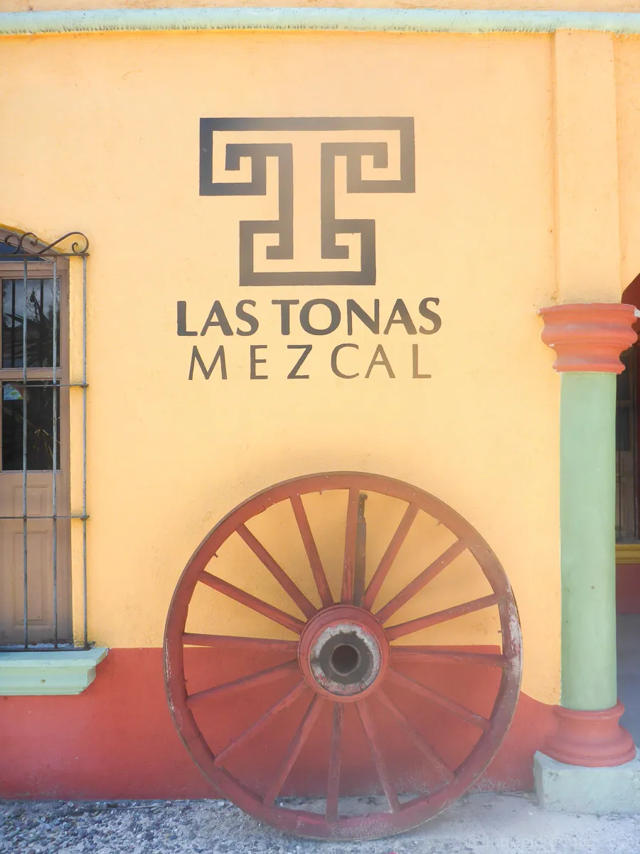 mezcal wheel against wall