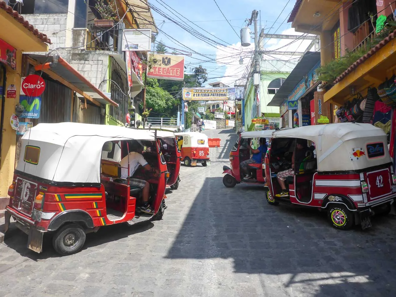 san pedro atitlan main street with tuk tuk